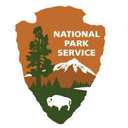 Logo of the National Park Service, featuring a tree and a buffalo